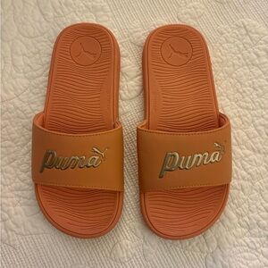 Puma Orange Slides with Metallic Gold Logo
